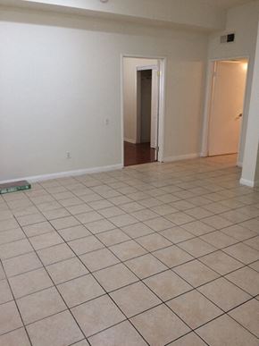 Panorama City apartment for rent - an empty living room with a tiled floor