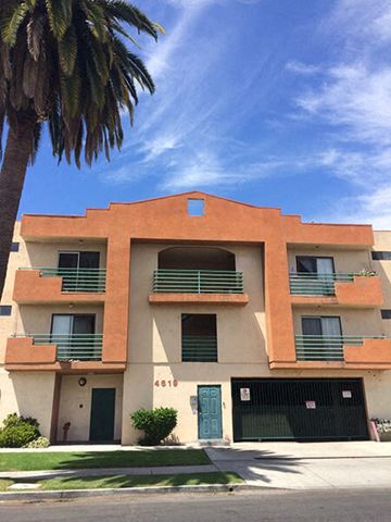 Los Angeles apartment for rent - a building with a palm tree in front of it