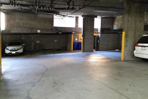 Los Angeles apartment for rent - an empty parking garage with cars in it
