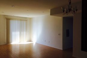 Los Angeles apartment for rent - an empty living room with wood floors and a sliding glass door