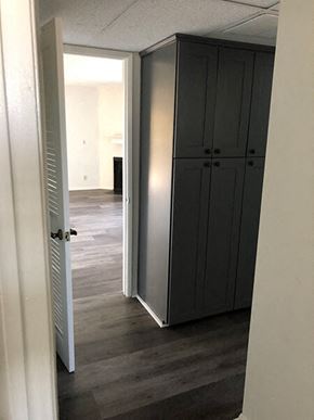 Van Nuys apartment for rent - a hallway with a closet and a door open