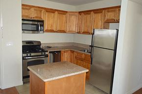 Los Angeles apartment for rent - a kitchen with stainless steel appliances and wooden cabinets