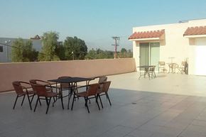 Los Angeles apartment for rent - a patio with a table and chairs on a roof