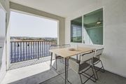 Carlsbad apartment for rent - A balcony with a table and chairs overlooking a pool at Montecito at Carlsbad, Carlsbad, CA 92010