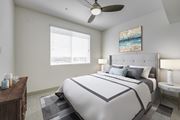 Carlsbad apartment for rent - A bedroom with a large bed and a ceiling fan at Montecito at Carlsbad, Carlsbad, CA 92010