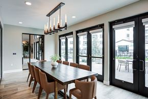 San Ramon apartment for rent - A modern dining room with a long table and chairs at Pradera Apartments, CA, 94582
