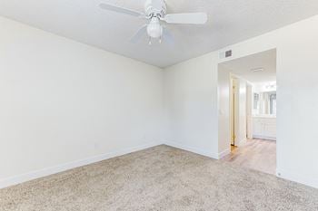 Room with carpeted floor and ceiling fan