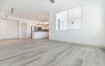 A bedroom with a medium sized bed next to a window
