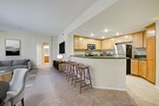 Porter Ranch apartment for rent - a kitchen and living room with wood cabinetry  at Sonoma at Porter Ranch, Porter Ranch, California