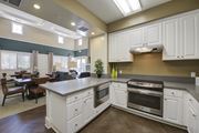 Porter Ranch apartment for rent - a kitchen with white cabinets and stainless steel appliances  at Ventana Senior Apartments, California, 91326