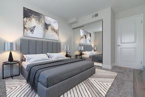 Laguna Niguel apartment for rent - an upscale bedroom with a bed and a mirror  at Laguna Gardens Apts., Laguna Niguel