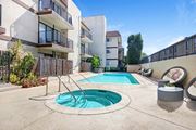 Reseda apartment for rent - a swimming pool and spa in front of an apartment building  at Sherway Villa, Reseda, 91335