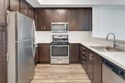 San Ramon apartment for rent - a kitchen with wooden cabinets and stainless steel appliances at Deer Creek Apartments, California, 94582