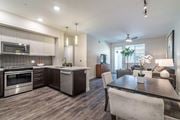 Carlsbad apartment for rent - Kitchen with stainless steel appliances and breakfast bar and dining at Montecito Apartments at Carlsbad, Carlsbad, CA