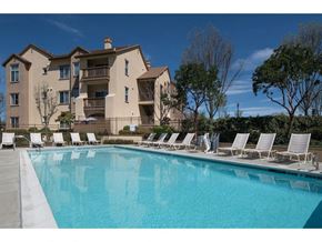 San Ramon apartment for rent - resort style swimming pool with lounge chairs at Seville at Gale Ranch, California