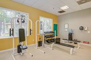 Los Angeles apartment for rent - a fitness center with exercise equipment at the whispering winds apartments in pearland, tx  at Tesoro Senior Apartments, Porter Ranch, CA, 91326