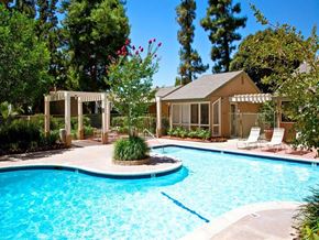 Lake Forest apartment for rent - a swimming pool with a house in the background