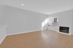 Los Feliz apartment for rent - a living room with a fireplace and a wooden floor