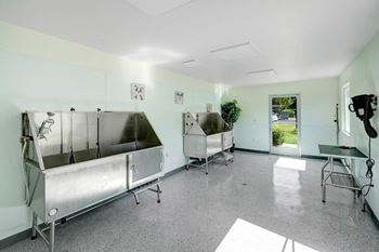 A large room with two large stainless steel refrigerators in it