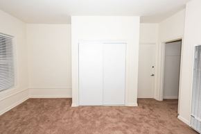 Santa Monica apartment for rent - A room with a white door and carpeted floor.