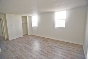 Santa Monica apartment for rent - A room with light vinyl flooring and two windows.