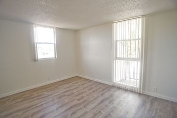 Santa Monica apartment for rent - A room with wooden flooring and two windows.