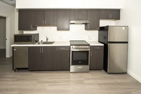 Santa Monica apartment for rent - Sample Unit: Kitchen and Appliances including refrigerator, microwave, stove, and cabinets
