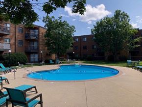St Cloud apartment for rent - a swimming pool in front of an apartment building