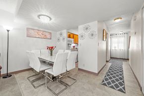 Burnsville townhouse for rent - A dining room with a white table and chairs.