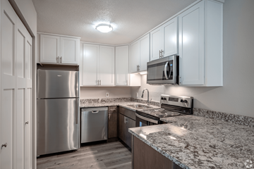 Stillwater apartment for rent - A kitchen with a granite countertop and stainless steel appliances.