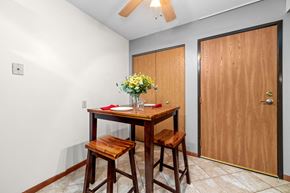 Forest Lake apartment for rent - A dining room with a wooden table and chairs.
