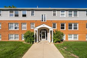 Owatonna apartment for rent - the front of a brick building with a sidewalk in front