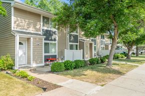 Stillwater townhouse for rent - a row of town homes with trees and sidewalks
