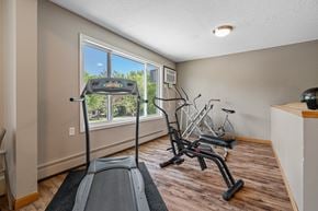 Faribault apartment for rent - the gym has plenty of exercise equipment and a window