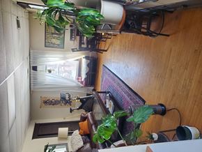 Minneapolis apartment for rent - A room with a couch, a table, and a window.