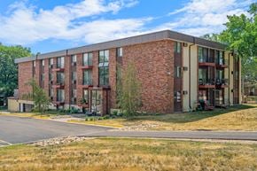 Stillwater apartment for rent - a brick apartment building with a road in front of it