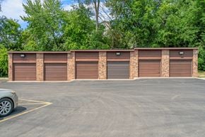 Stillwater apartment for rent - a row of garage doors in a parking lot