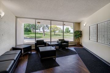 Maplewood apartment for rent - a living room with leather furniture and large windows