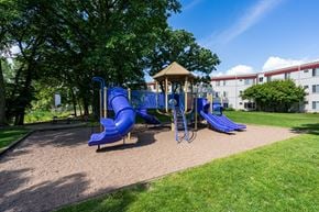 Maplewood apartment for rent - a playground with blue slides and a gazebo