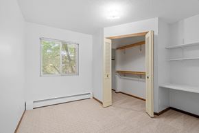 St Cloud apartment for rent - a bedroom with a closet and a window and a bathroom