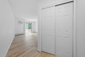 St Cloud apartment for rent - the living room and dining room of a house with white walls and doors