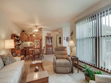 Stillwater apartment for rent - a living room with a couch and a chair and a kitchen