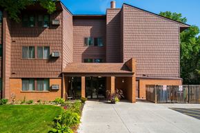 North Branch apartment for rent - a large brick building with a sidewalk in front of it