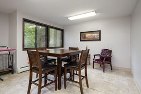 North Branch apartment for rent - A dining room with a table and chairs.