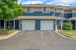 Stillwater apartment for rent - a blue house with two white garage doors