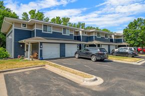 Stillwater apartment for rent - a blue house with cars parked in front of it