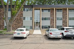 Mankato apartment for rent - the front of a building with three cars parked in front of it