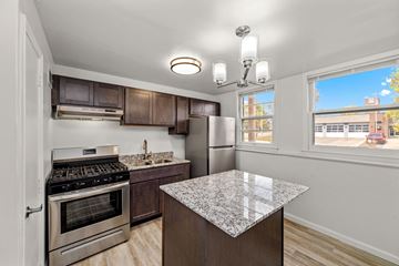 Faribault apartment for rent - A kitchen with a granite counter top and stainless steel appliances.