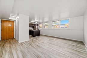 Faribault apartment for rent - A room with a wooden door and a white wall.