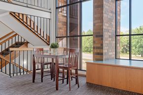 St Cloud apartment for rent - a dining room with a table and chairs and a large window